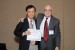 Dr. Nagib Callaos, General Chair, giving Prof. Shigehiro Hashimoto the best paper award certificate of the session "Biological Engineering." The title of the awarded paper is "Responses of Cells to Flow in Vitro."